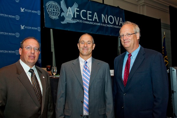 Cusano (l) and Dave Wennergren (r), assistant deputy chief management officer, U.S. Defense Department, congratulate Thomas on his Super NOVA Award in September.